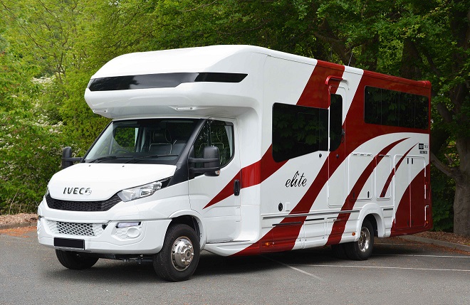 White and red horse box in car park