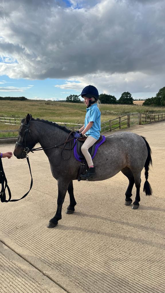 Girl riding horse